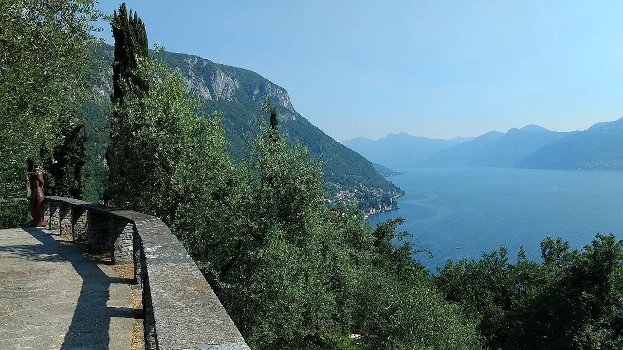 Stone walkway at Castello di Vezio overlooking Lake Como and the mountains beyond Varenna