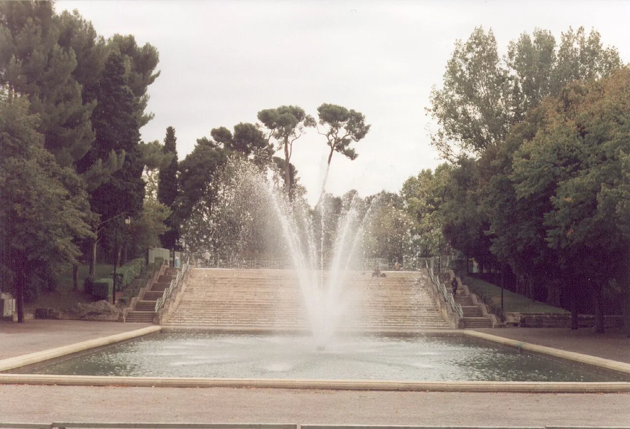 Fountain and wide stone steps among pines in Parc Jourdan, Aix-en-Provence
