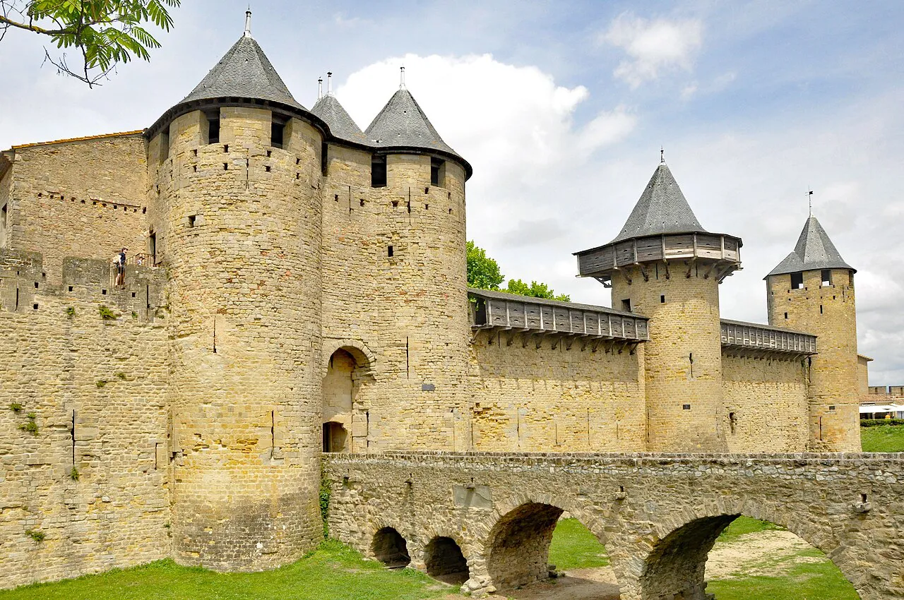 Towers and stone bridge of the Château Comtal inside the Cité de Carcassonne on a sunny day