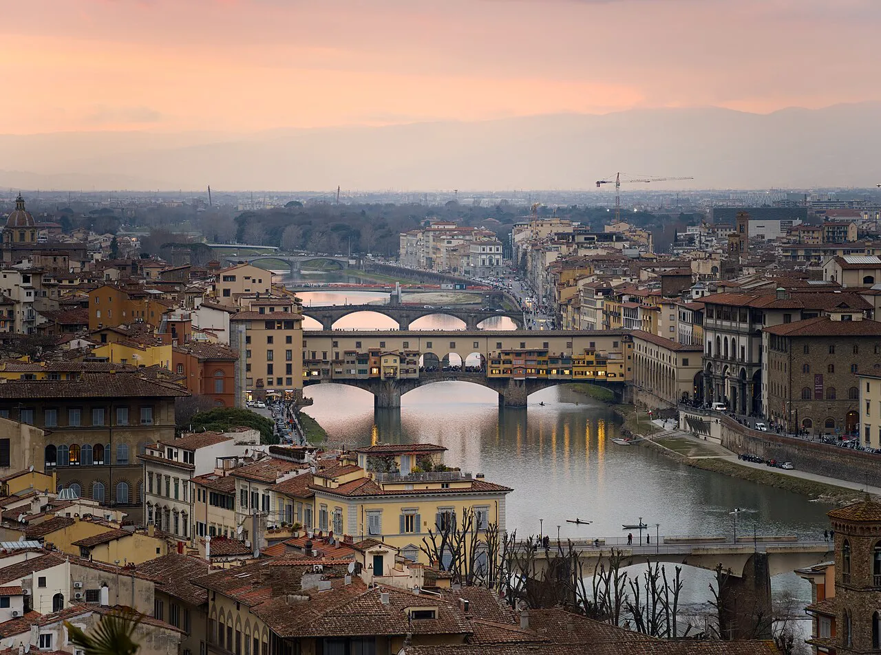 Sunset over Florence rooftops and the Arno, with Ponte Vecchio, seen from Piazzale Michelangelo