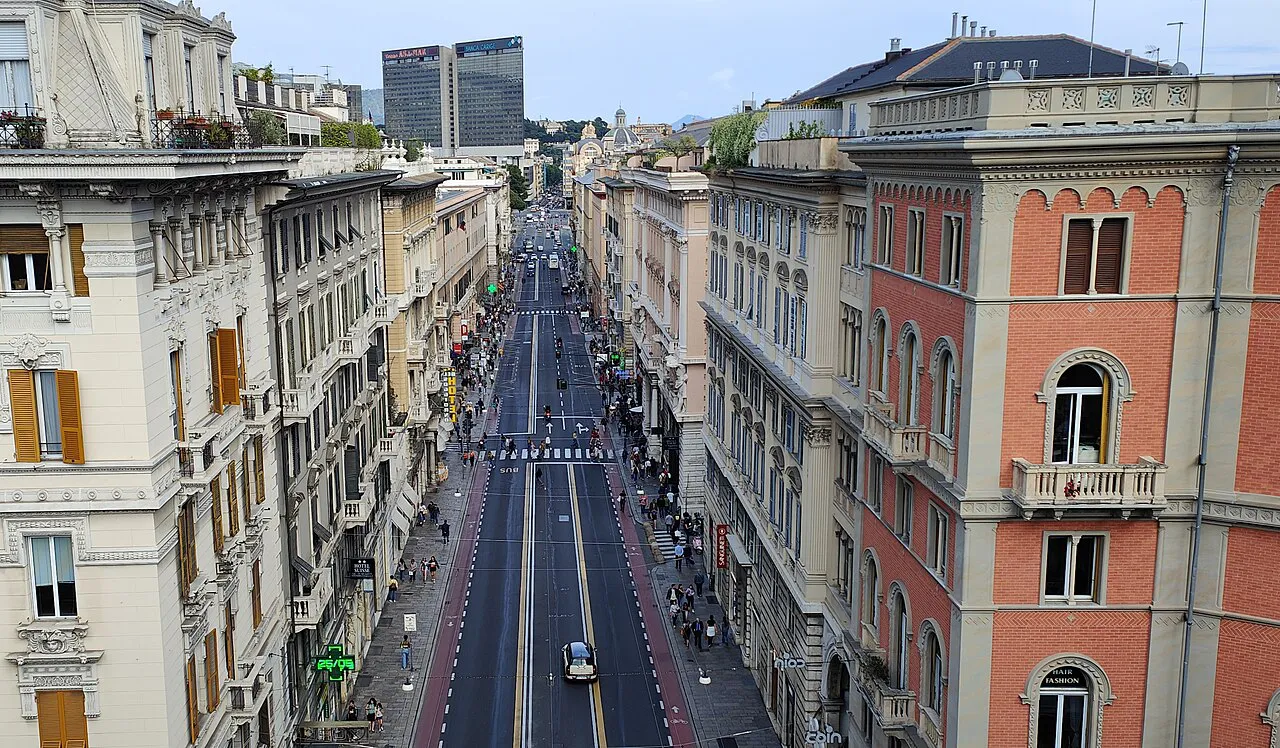 Via XX Settembre seen from above, lined with tall arcaded palazzi in central Genoa