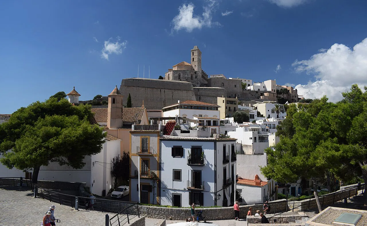 Whitewashed houses climbing to the cathedral tower of Dalt Vila in Ibiza Town