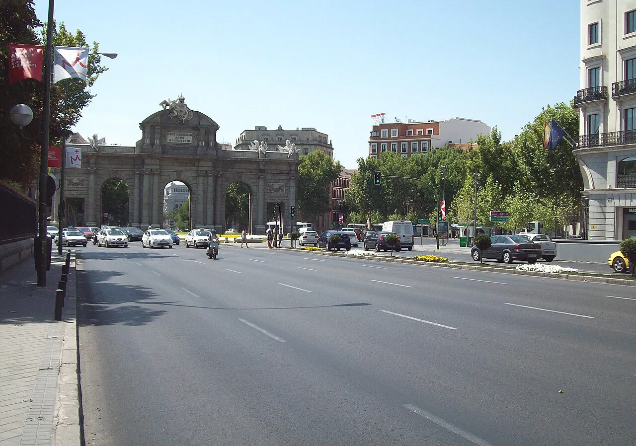 Puerta de Alcalá monument at the end of the broad Calle de Alcalá in Madrid on a sunny day