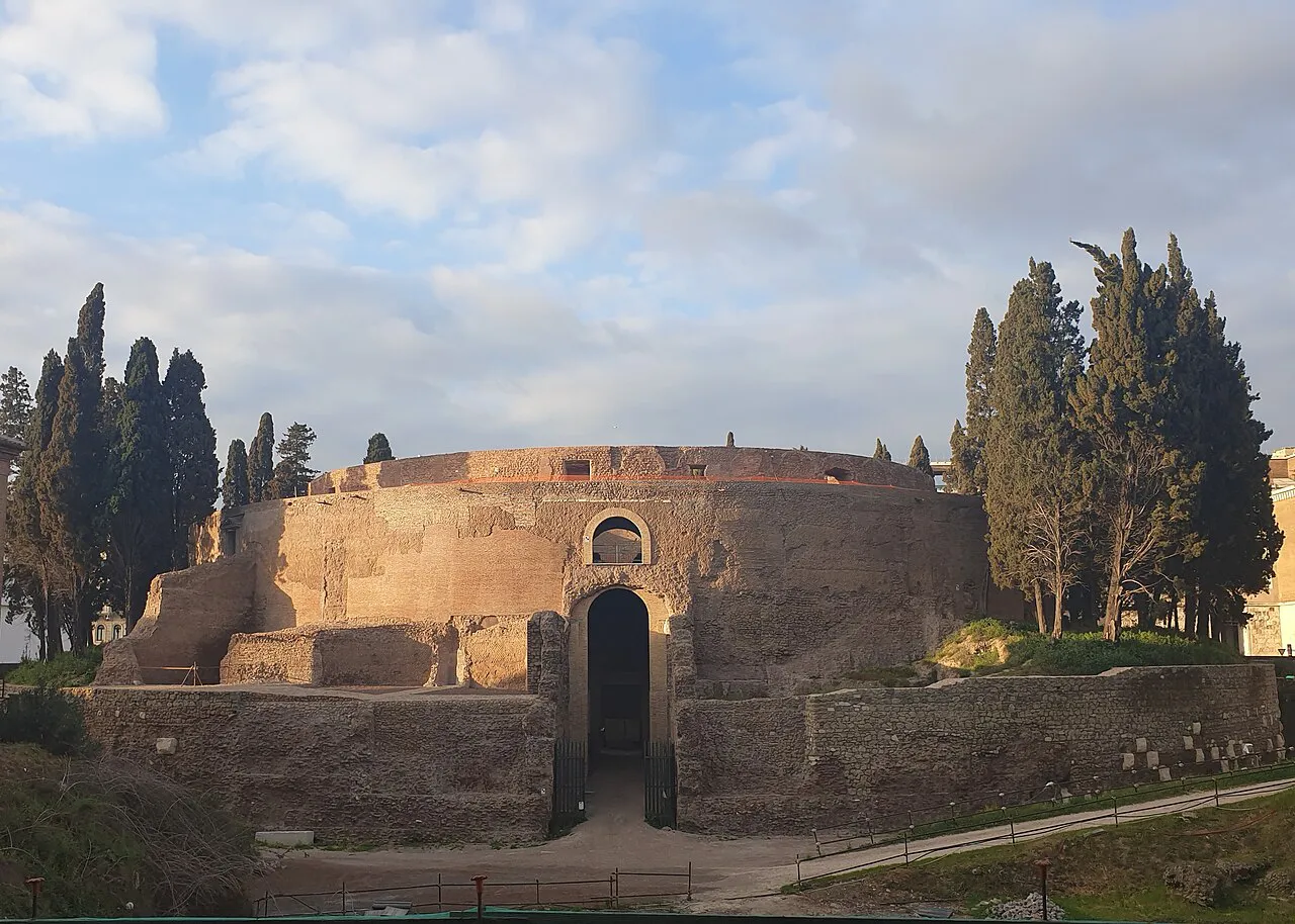 The round Mausoleum of Augustus framed by cypress trees in Rome