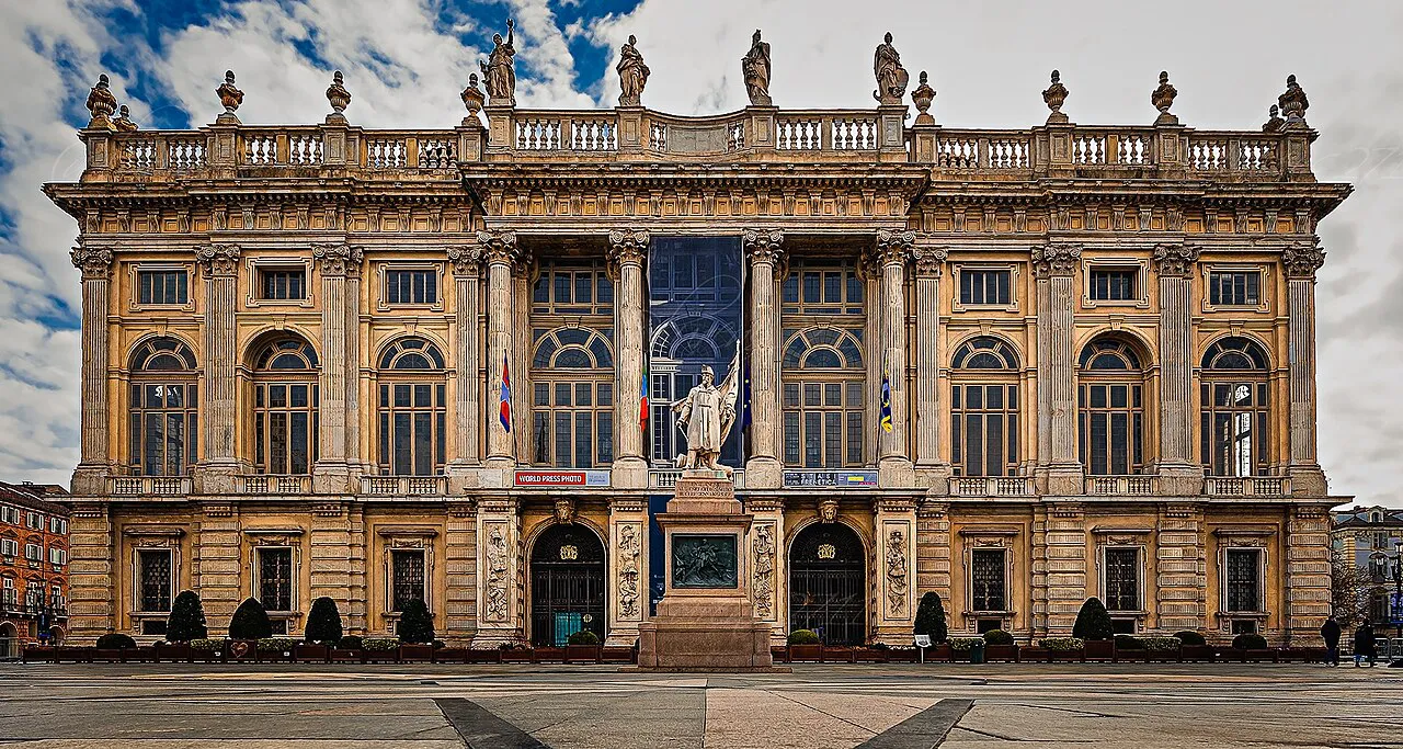 Ornate Baroque facade of Palazzo Madama in Turin's Piazza Castello, topped with statues