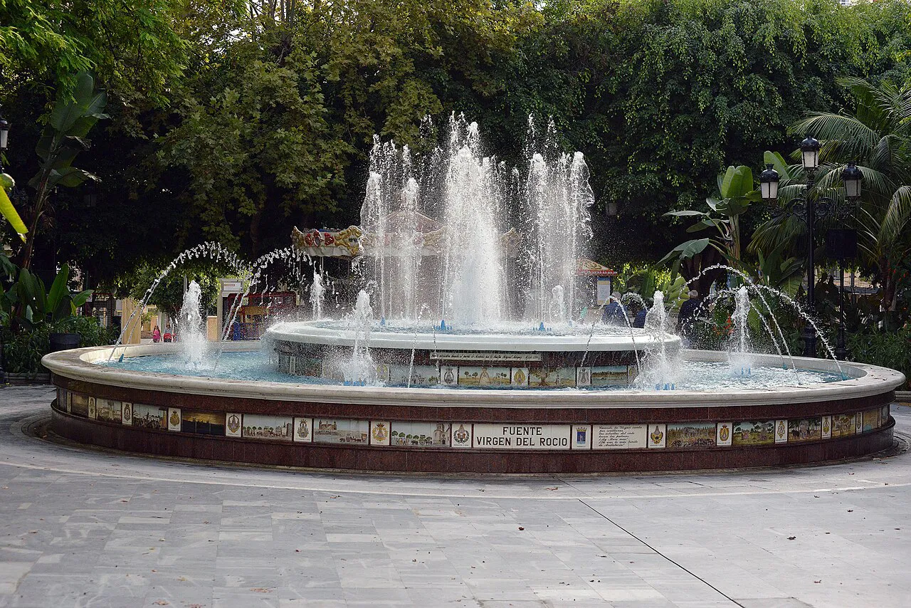 Circular fountain with tiled surround in Marbella's leafy Alameda Park, between the old town and the sea