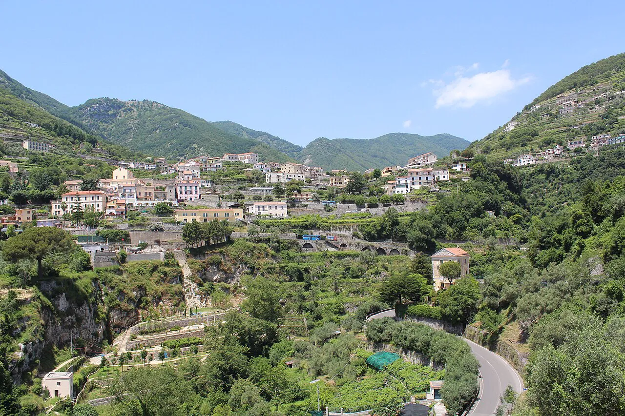 Terraced green valley with hillside villages and a winding road seen from Ravello on the Amalfi Coast