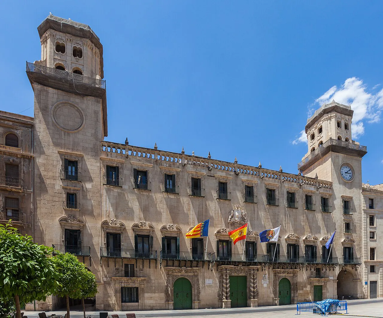 Baroque facade and twin towers of Alicante's Town Hall in the city centre under a blue sky
