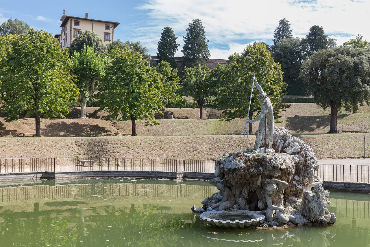 The Neptune Fountain in its pond, with lawns and cypress trees in the Boboli Gardens, Florence