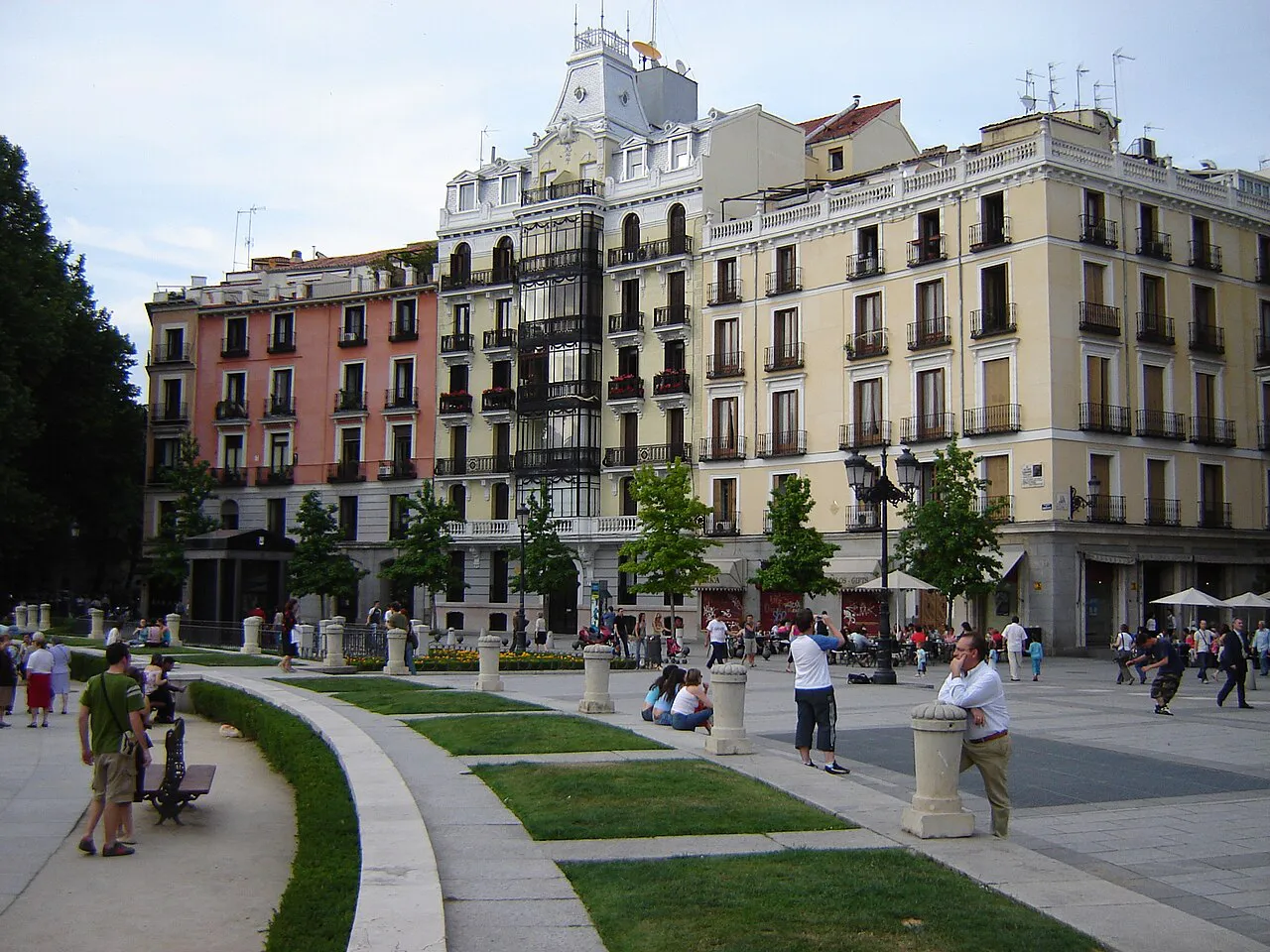 Gardens and pastel apartment buildings lining Plaza de Oriente in central Madrid