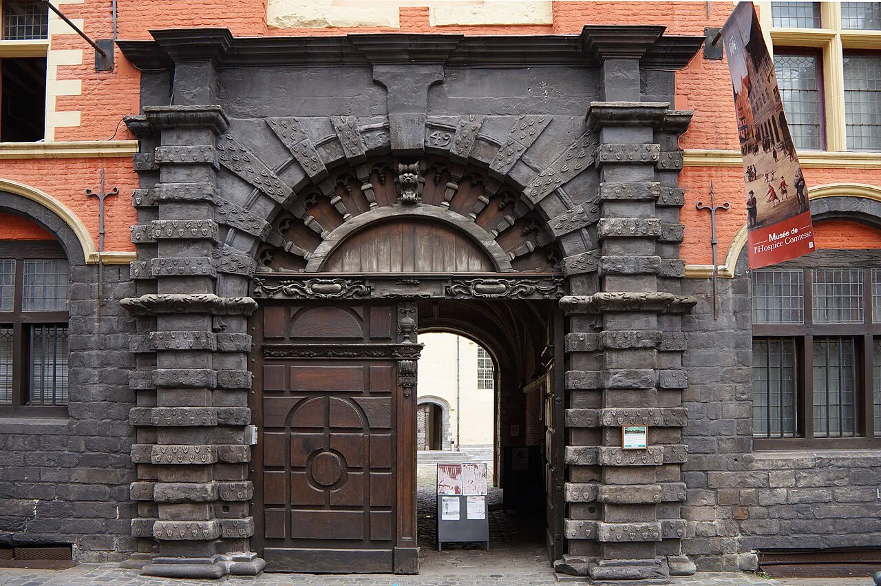 Carved stone porch of the Hospice Comtesse on Rue de la Monnaie, Vieux-Lille