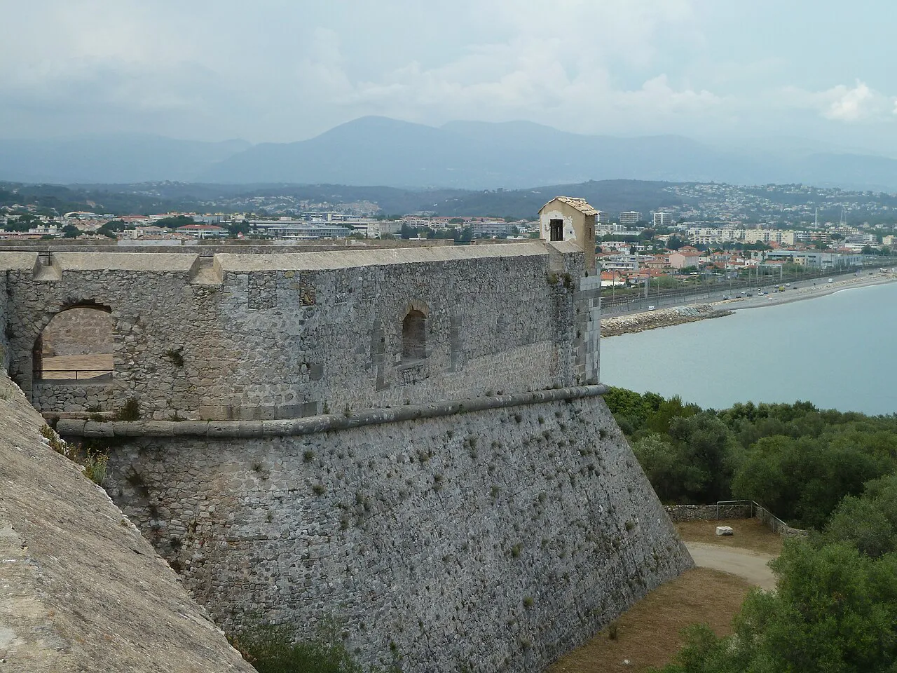 Massive stone bastion of Fort Carré above the coast and bay of Antibes