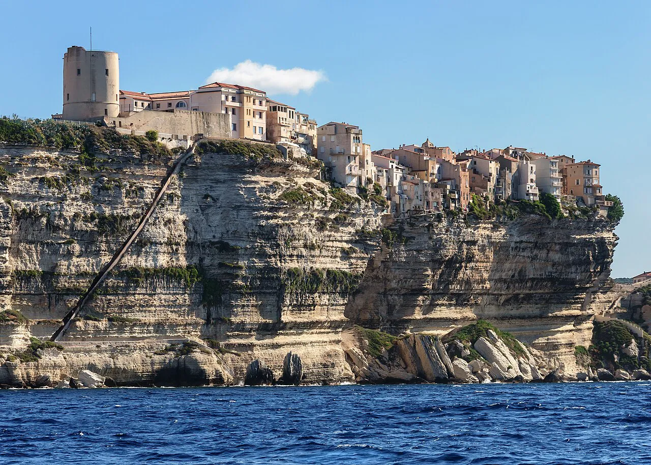 Bonifacio old town perched on white limestone cliffs above the sea, with the King of Aragon staircase