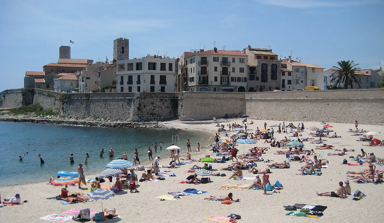 Plage de la Gravette beach in Antibes below the old town ramparts and houses