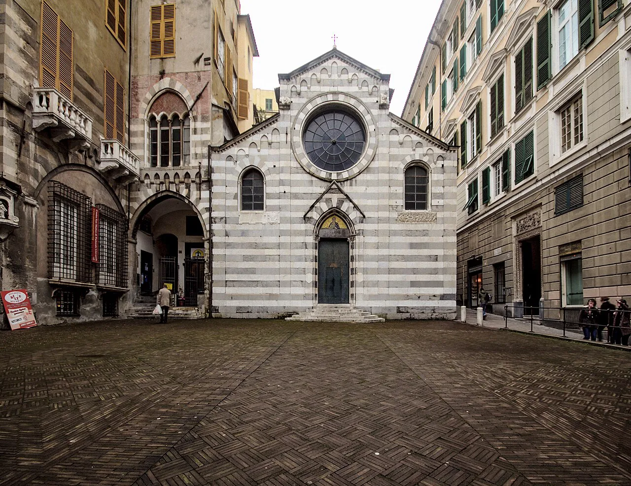 Striped Gothic facade of San Matteo church on its small paved square in Genoa’s historic centre