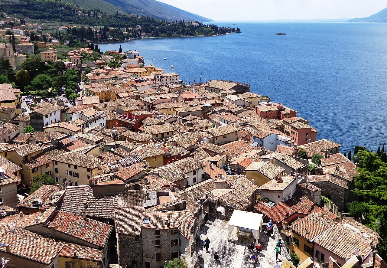 Terracotta rooftops of Malcesine old town stretching along the shore of Lake Garda