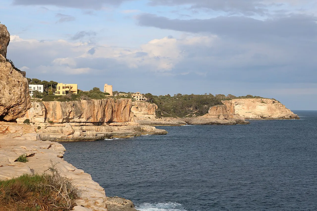 Limestone cliffs and a rocky inlet on the coast at Cala Santanyí, southeast Mallorca