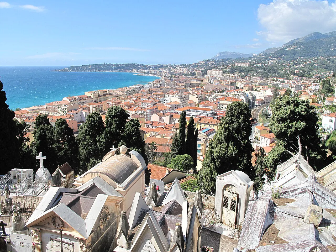View over Menton’s rooftops and the curving western seafront from the old-town cemetery