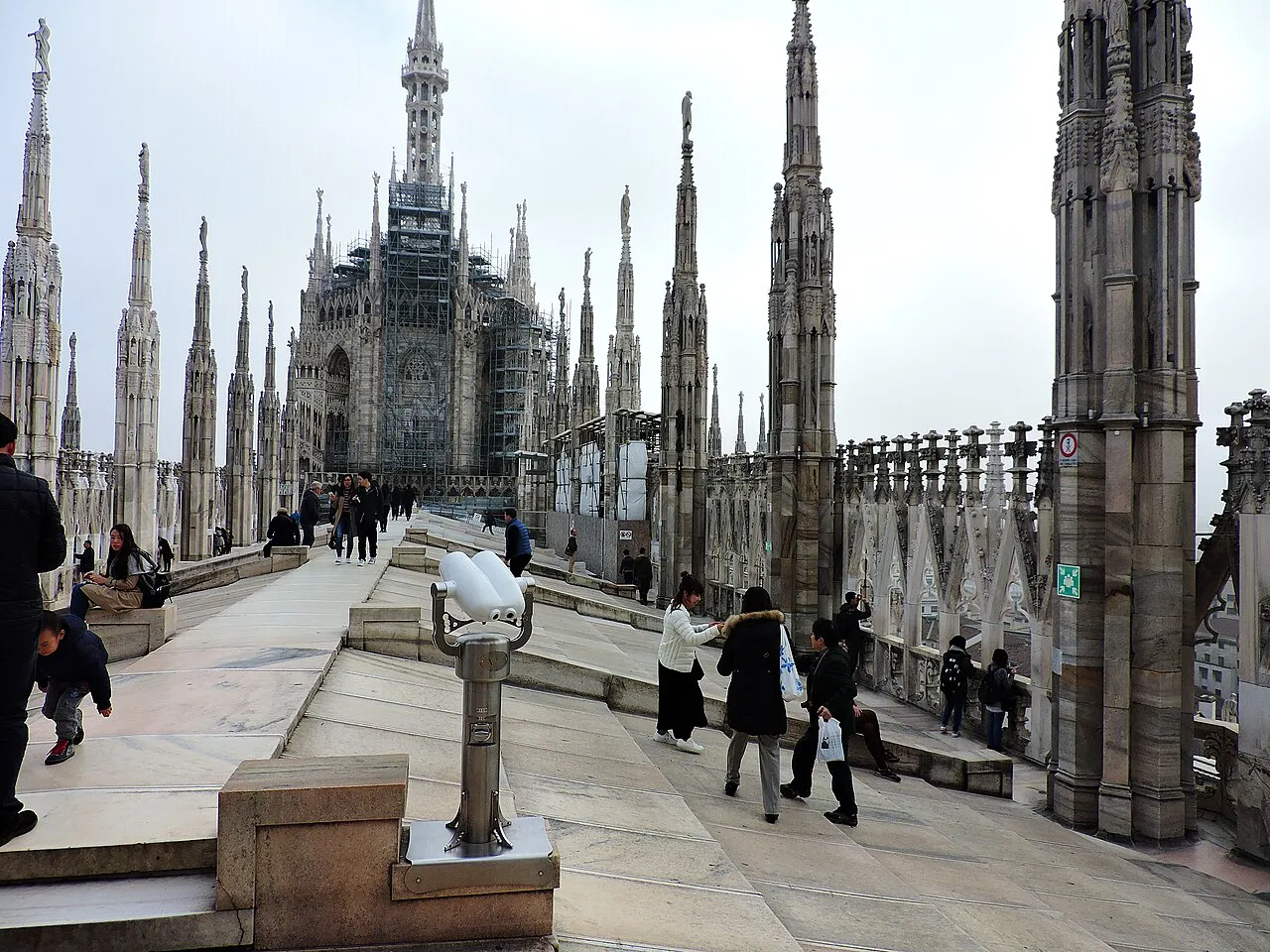 Marble roof terraces of Milan Cathedral lined with Gothic spires and pinnacles