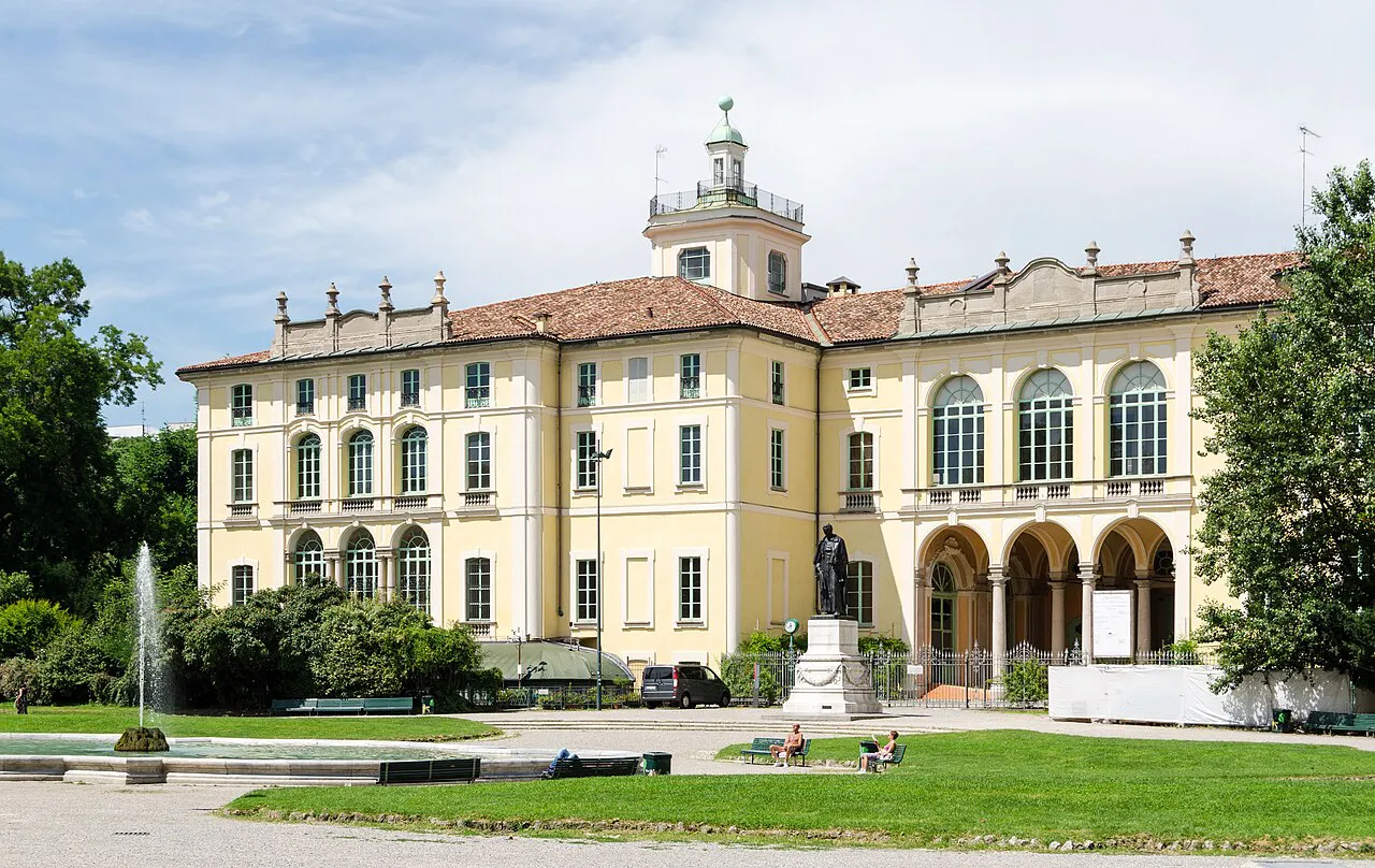 Yellow Palazzo Dugnani with a fountain and lawns in Milan’s Giardini Pubblici Indro Montanelli