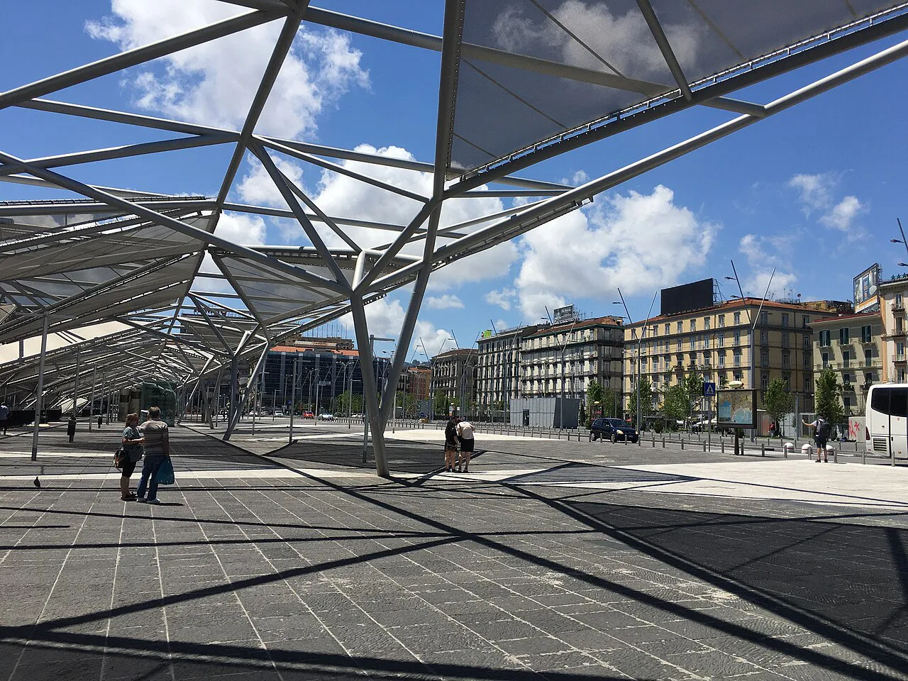 Modern steel canopy over the paved Piazza Garibaldi in front of Napoli Centrale