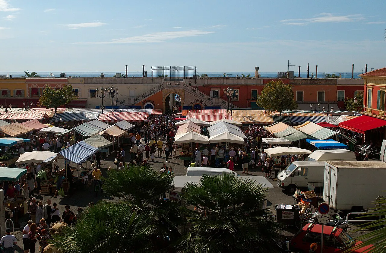 Market stalls and awnings filling Cours Saleya in Vieux Nice, seen from above