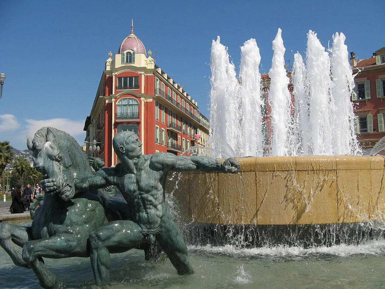 Fontaine du Soleil bronze sculpture and water jets at Place Masséna, Nice