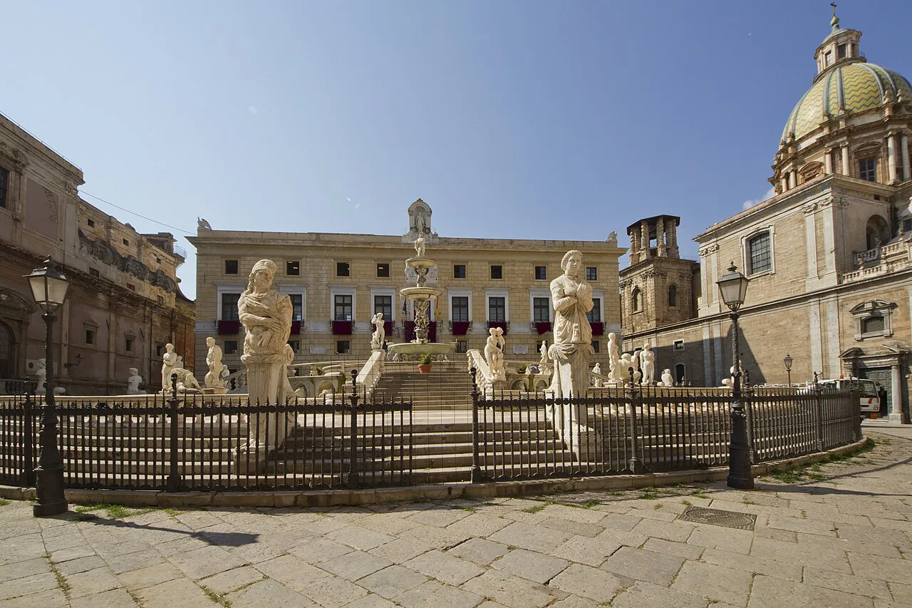 Fontana Pretoria with its marble statues and the dome of Santa Caterina on Piazza Pretoria, Palermo