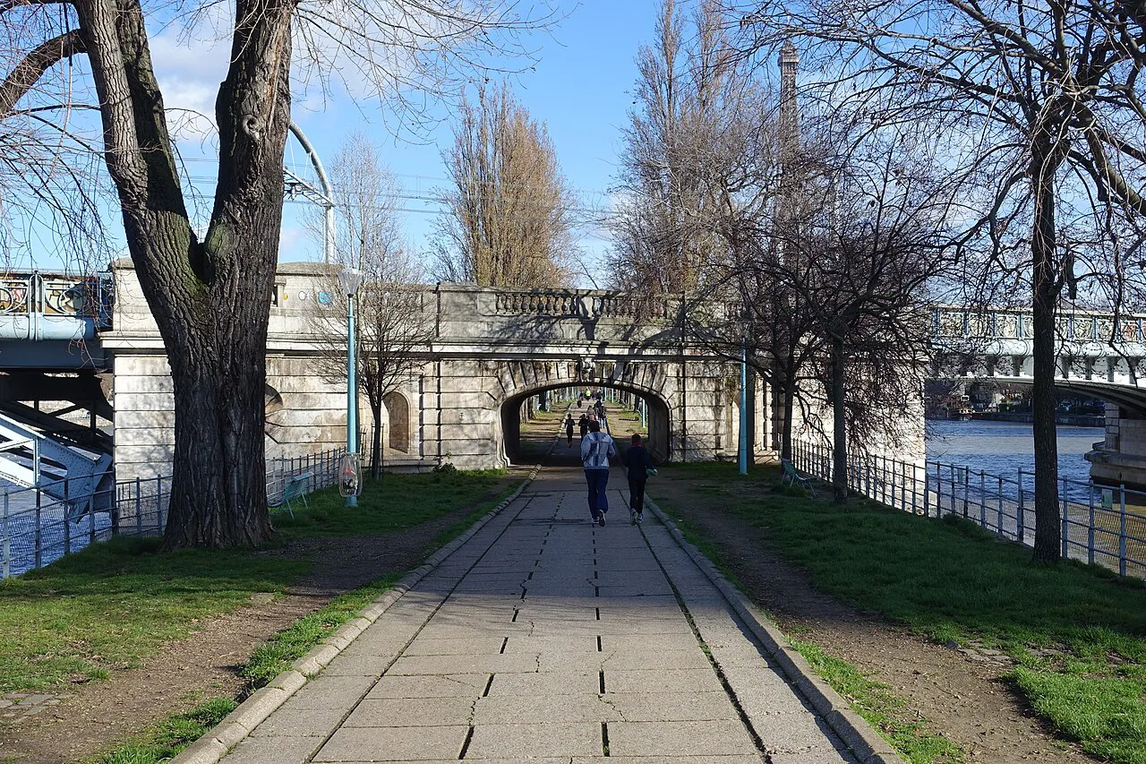 Tree-lined Allée des Cygnes path on the Île aux Cygnes in the 15th arrondissement of Paris