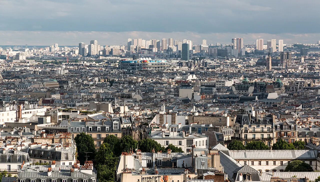 Wide view over the rooftops of Paris from the hilltop of Montmartre near Sacré-Cœur