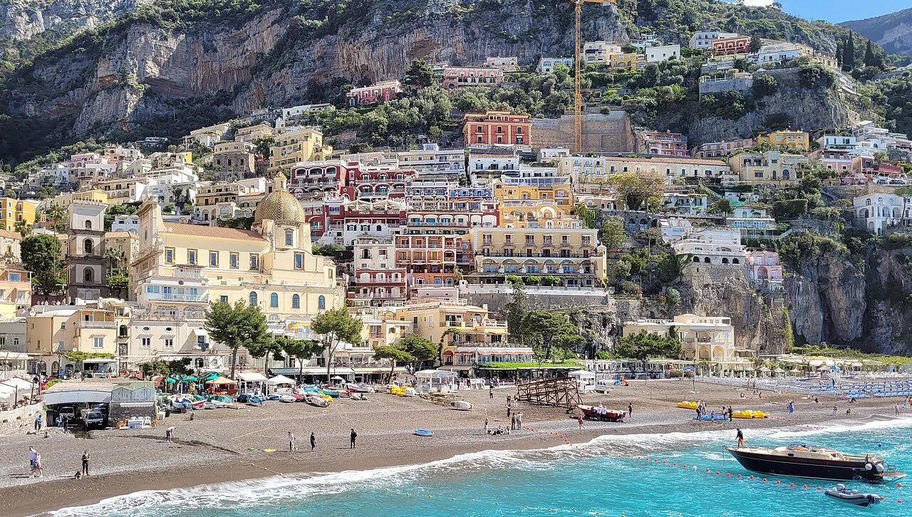 Spiaggia Grande beach and turquoise water below Positano's terraced hillside of colourful houses