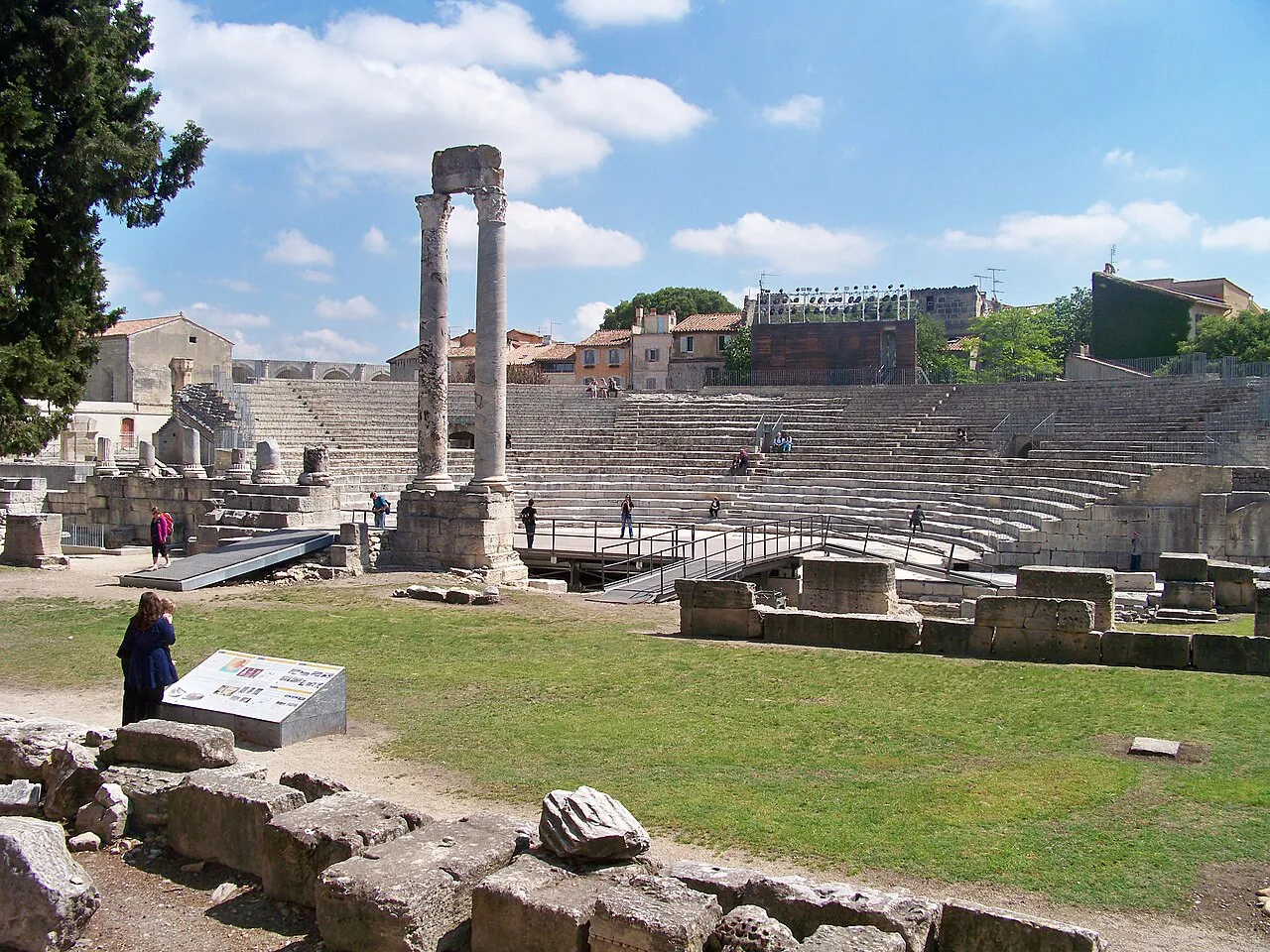 Stone tiers and two standing columns of the Roman theatre in Arles