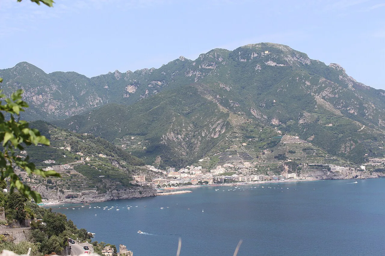Green mountains above a seaside town on the bay, seen from the heights of Ravello on the Amalfi Coast