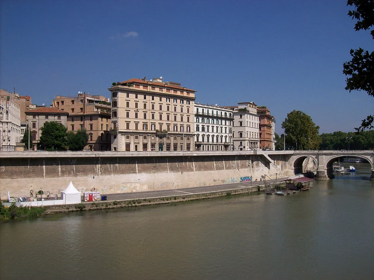 Lungotevere Prati embankment and Ponte Cavour over the Tiber in Rome under a clear sky