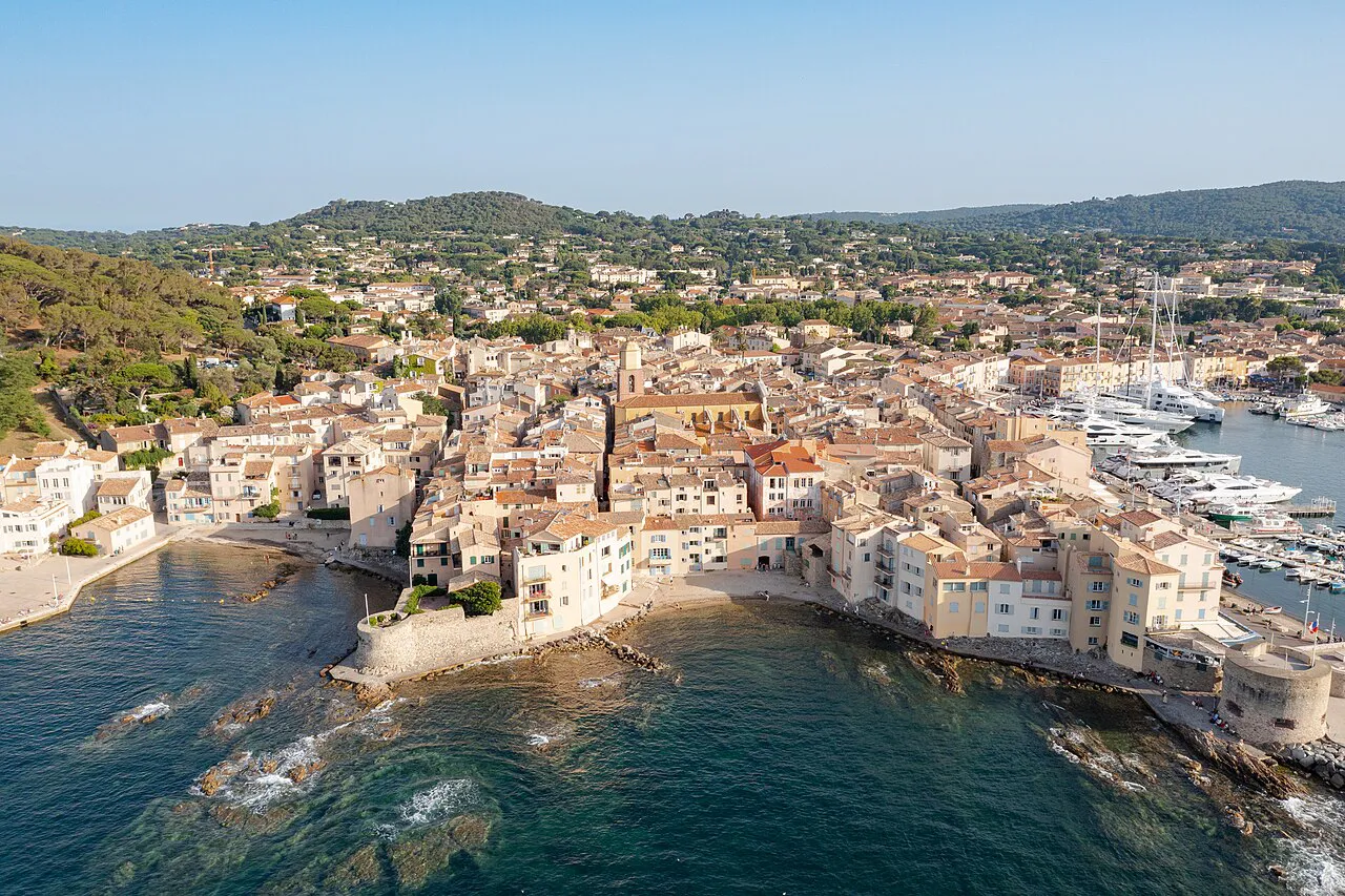 Aerial view of Saint-Tropez old town, its small sheltered cove and the hills beyond