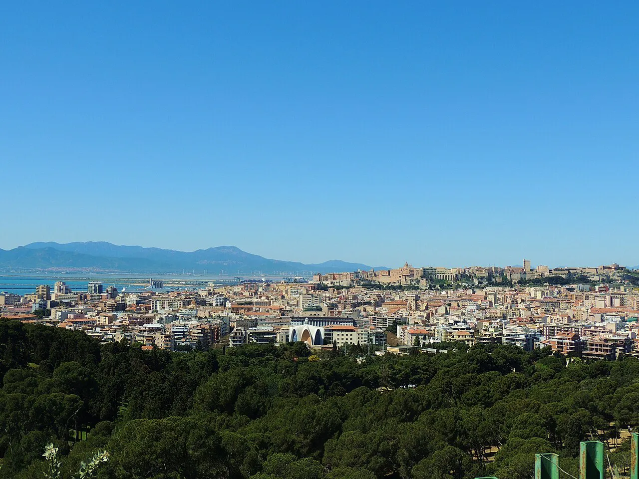Panorama of Cagliari's rooftops and the Gulf of Cagliari seen from the pines of Monte Urpinu park