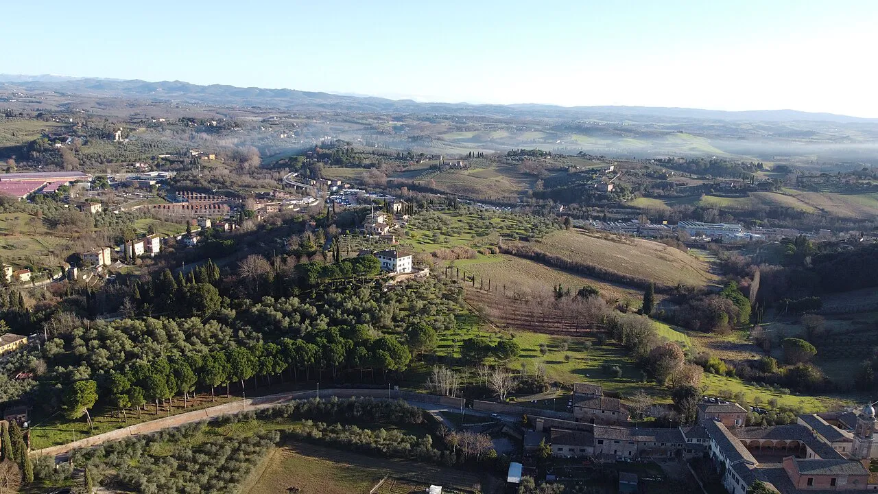 Rolling farmland, olive groves and scattered villas in the countryside just south of Siena