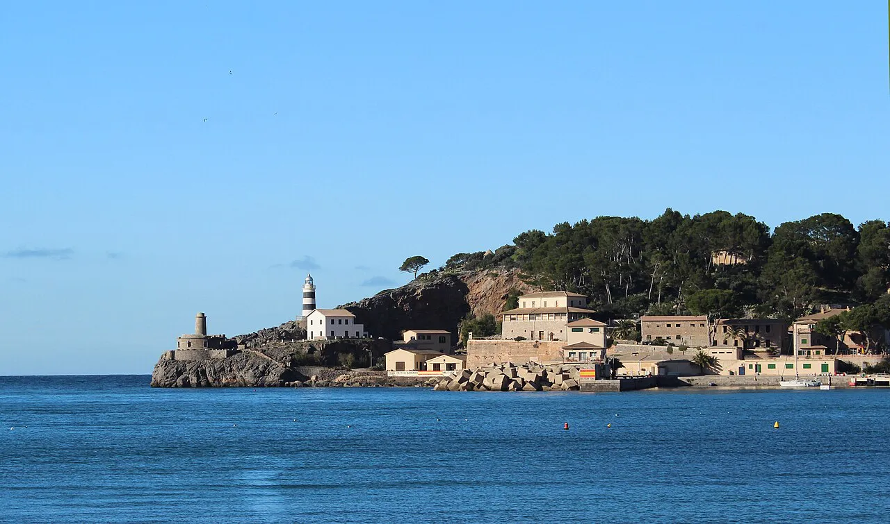 Sa Creu lighthouse headland and old buildings at the mouth of the bay of Port de Sóller