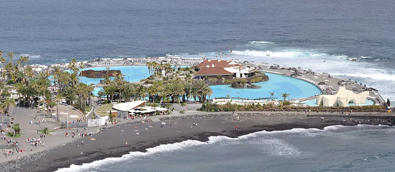 Seawater pools and palms of Lago Martiánez beside the black-sand beach of Puerto de la Cruz, Tenerife