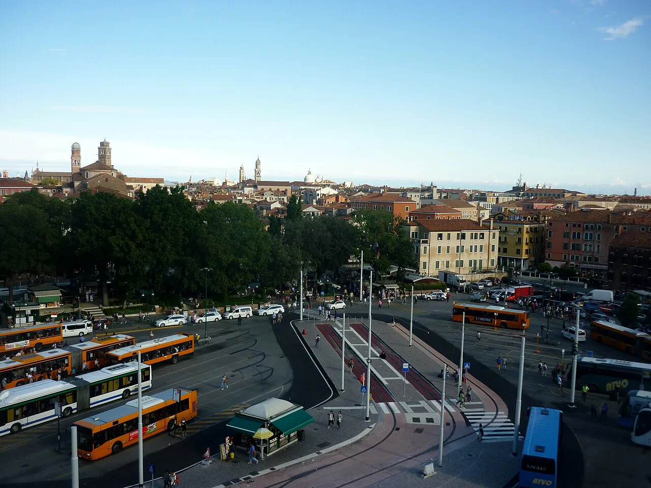 Piazzale Roma bus terminal and car area seen from above, with Venice rooftops beyond