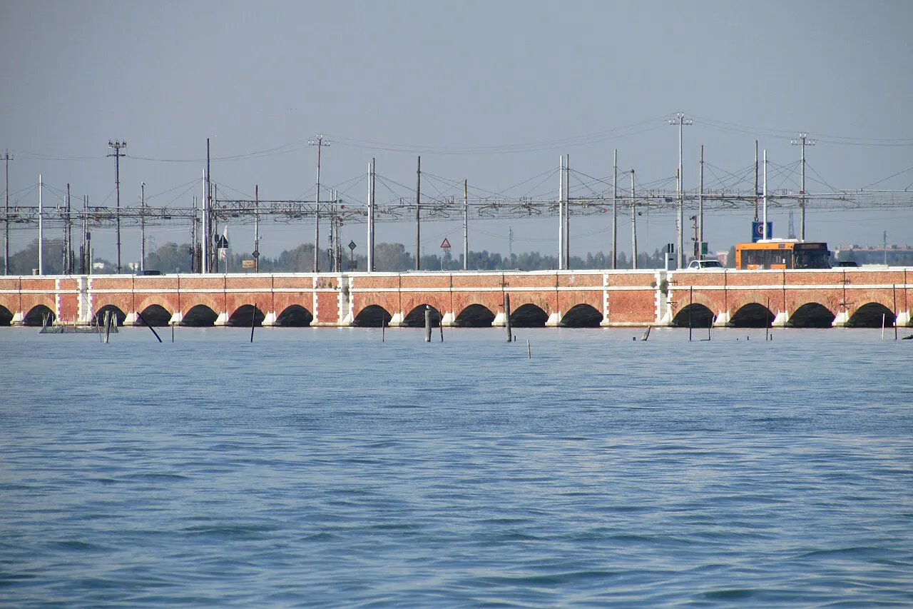 Brick arches of the Ponte della Libertà crossing the Venetian lagoon from the mainland
